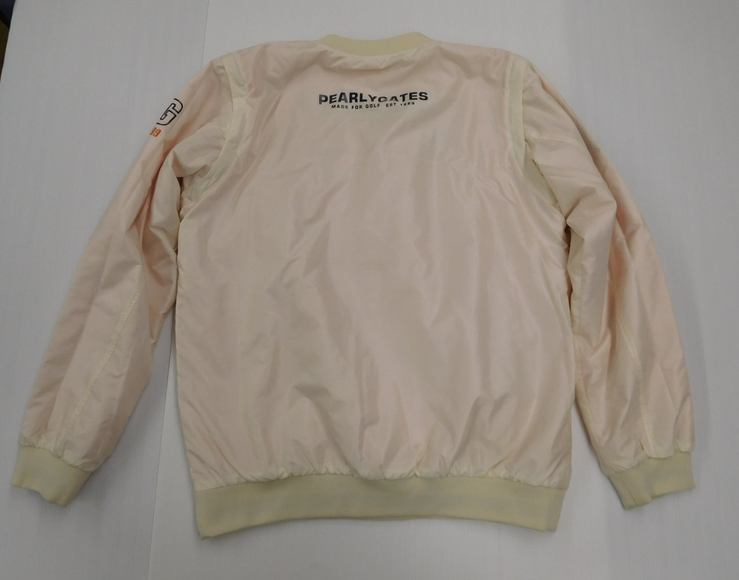 PERLY GATES パーリーゲイツ メンズゴルフウェア 中綿リバーシブルスニード ホワイト×オレンジ 袖着脱可 size:6 中古囗T巛